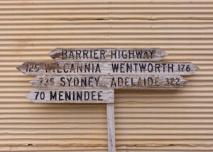 Distance sign at Sulphide Street Museum visited on Spirit of the Southwest